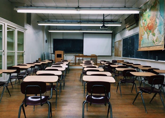 A classroom filled with empty chairs.