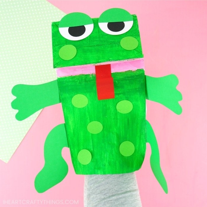 Cute green frog puppet made from a paper lunch bag.