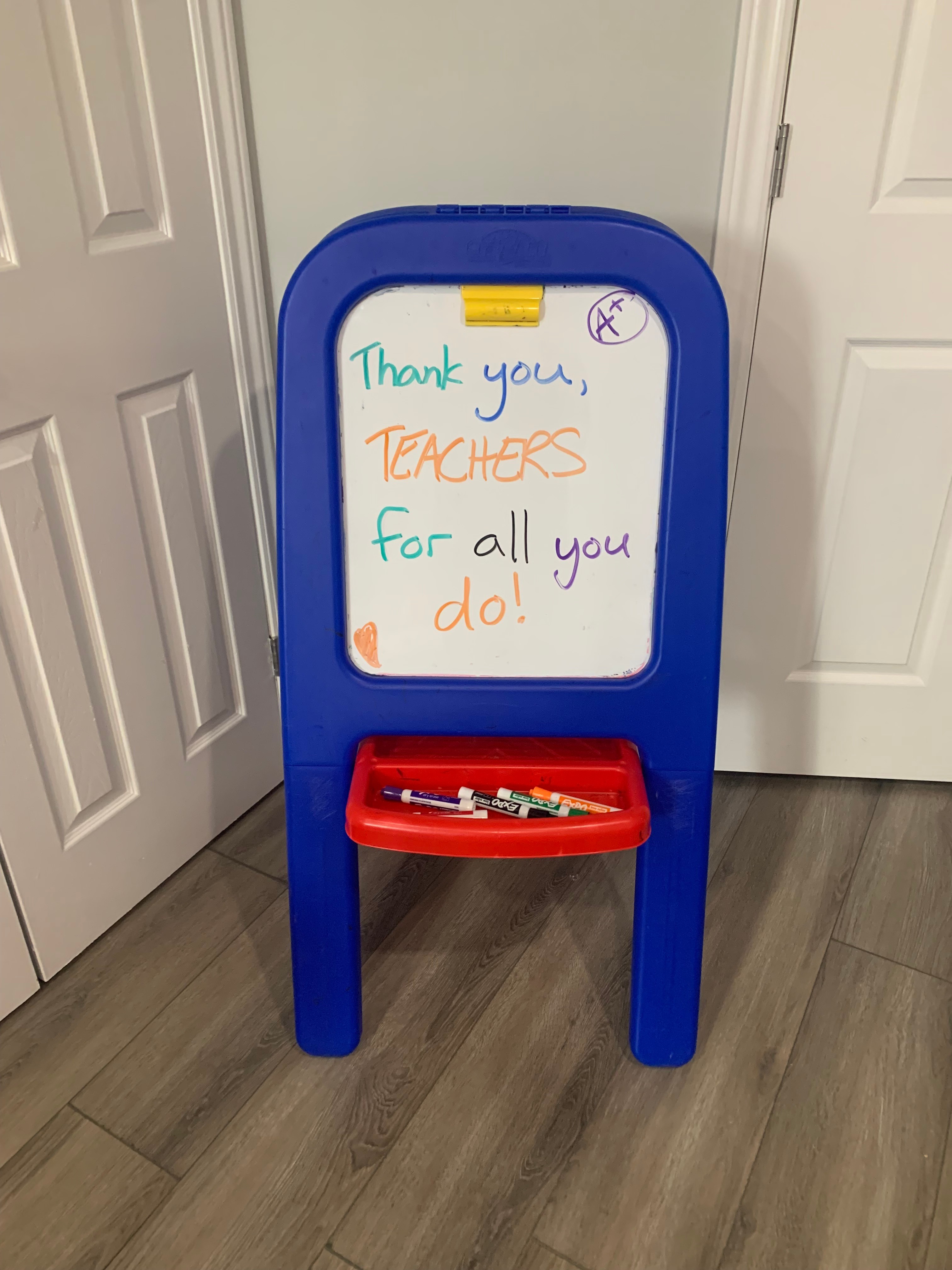 Dry Erase board with message on it reading "Thank you teachers for all you do!"