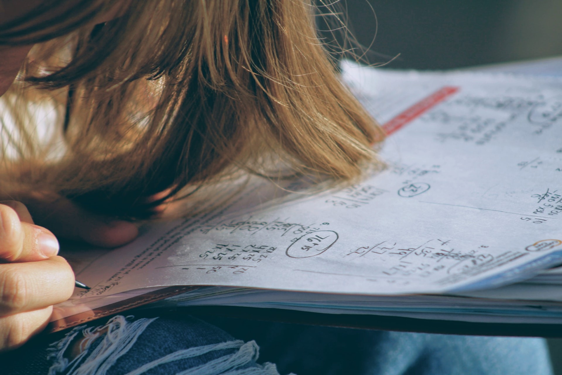 Close-up of student completing a math worksheet.