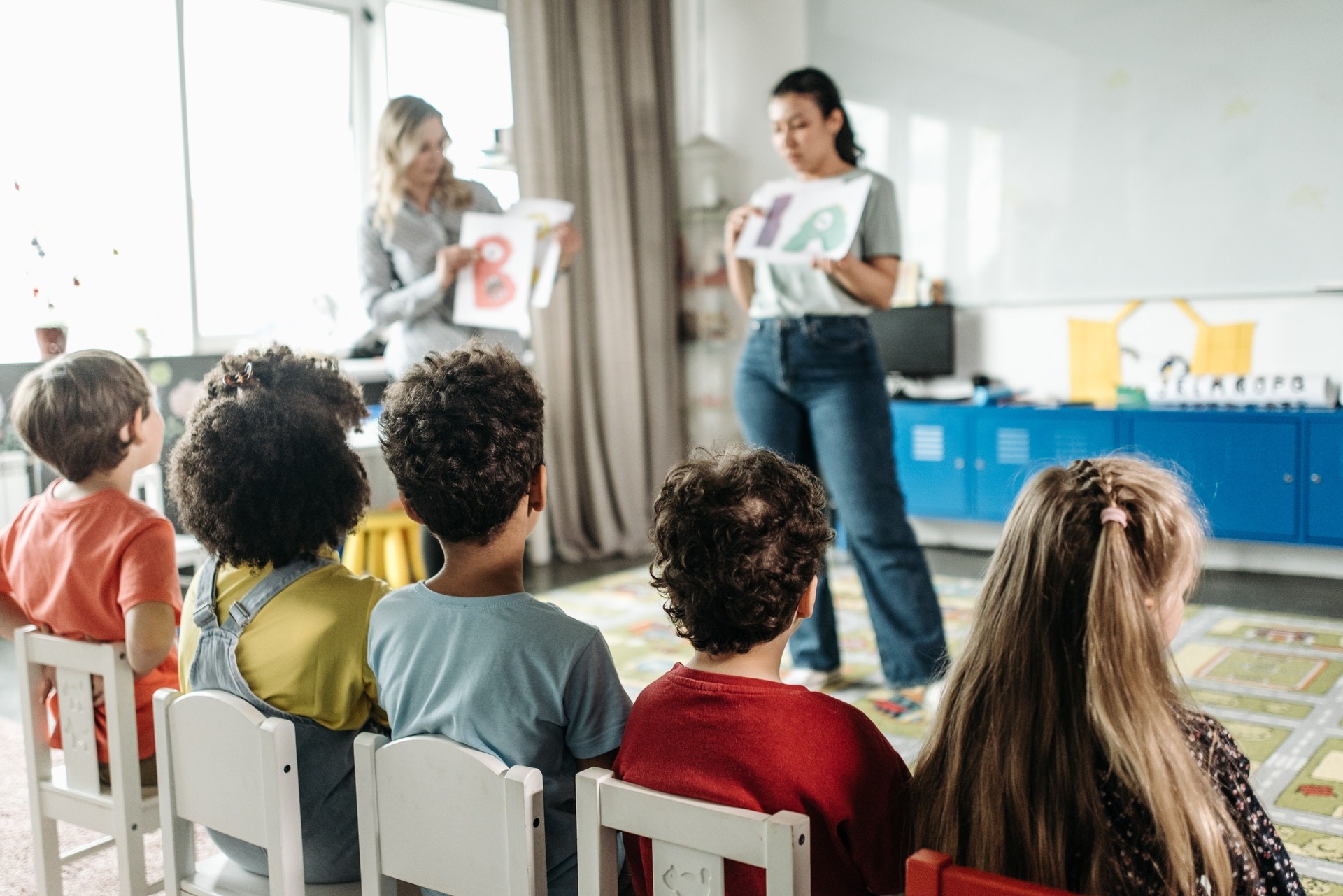 Two teachers use team teaching to deliver a lesson.