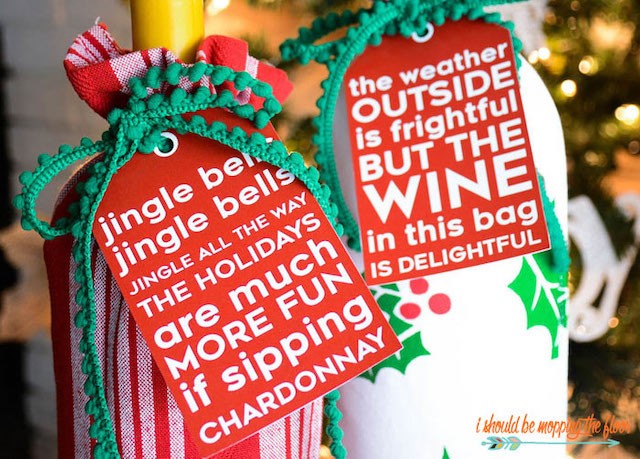 Wine bottles with holiday wrapping and gift tags.