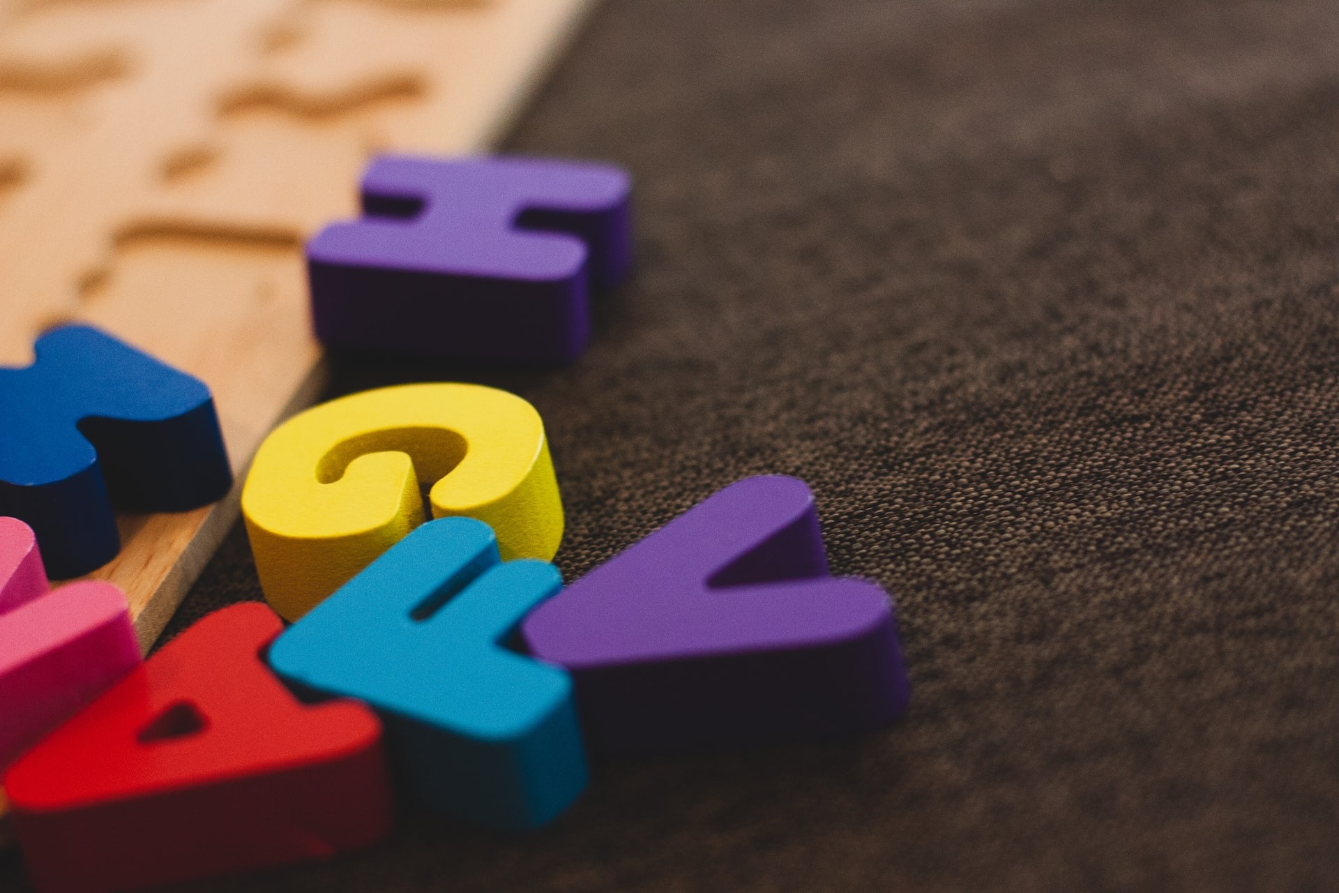 Wooden letters in a classroom for practicing phonological awareness.