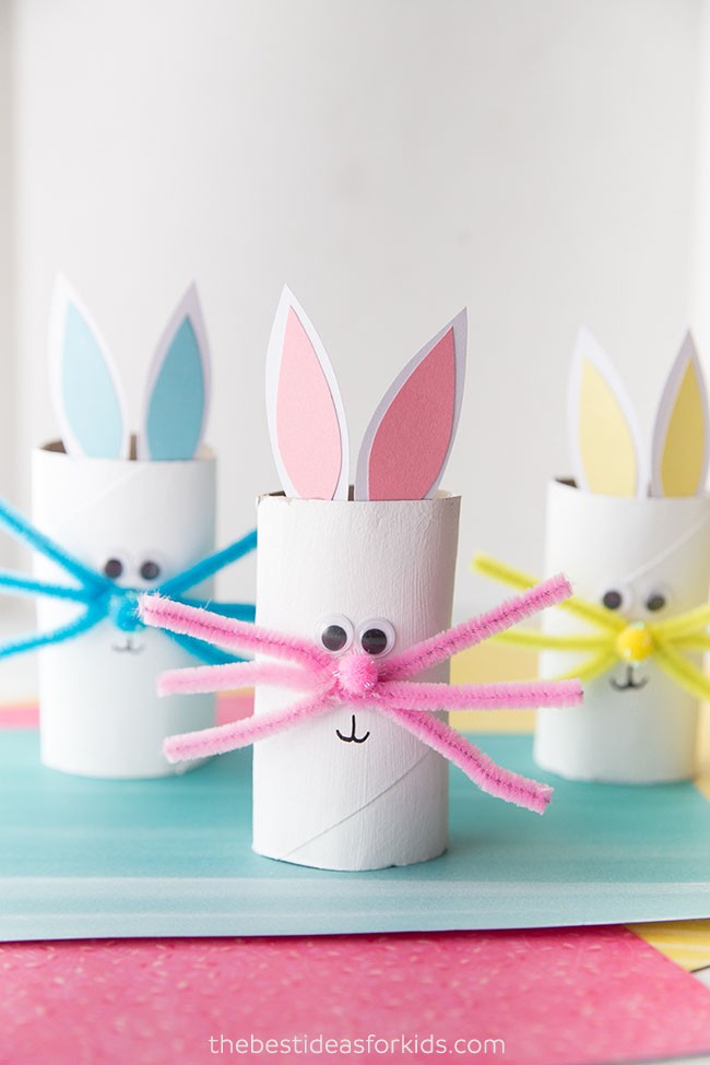 Toilet paper roll bunnies in blue, pink and yellow.
