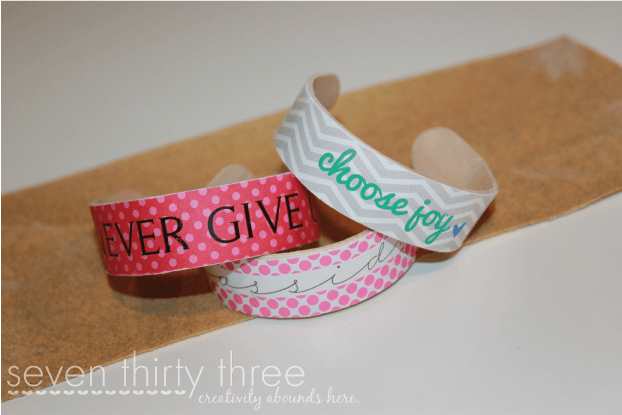 Kids' bracelets made from popsicle sticks and decorated with patterns and phrases ex. "choose joy."