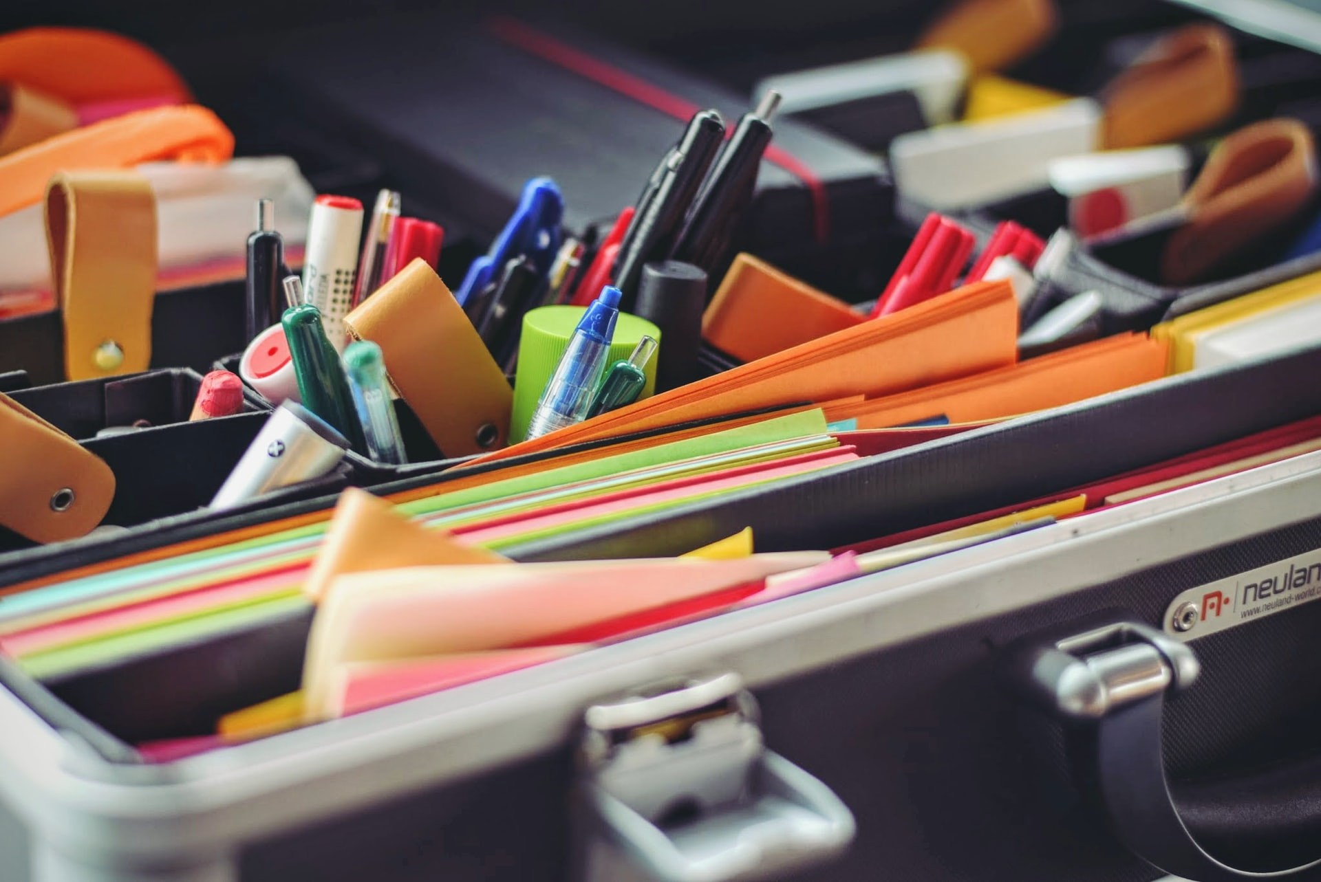 Box of papers, pens and other supplies for lesson planning.