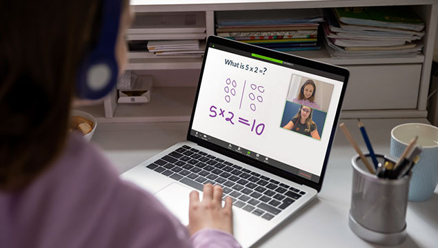 A student interacts with her Prodigy online math tutor through her laptop