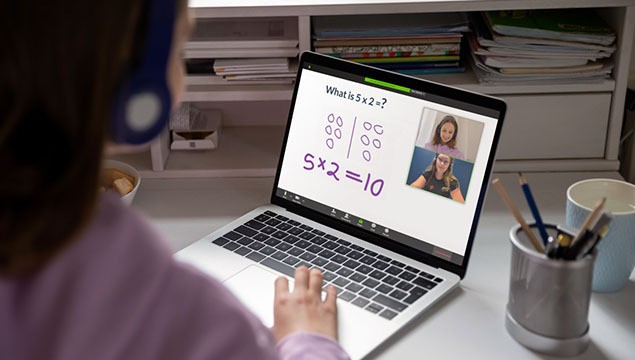 A student interacts with her Prodigy online math tutor through her laptop