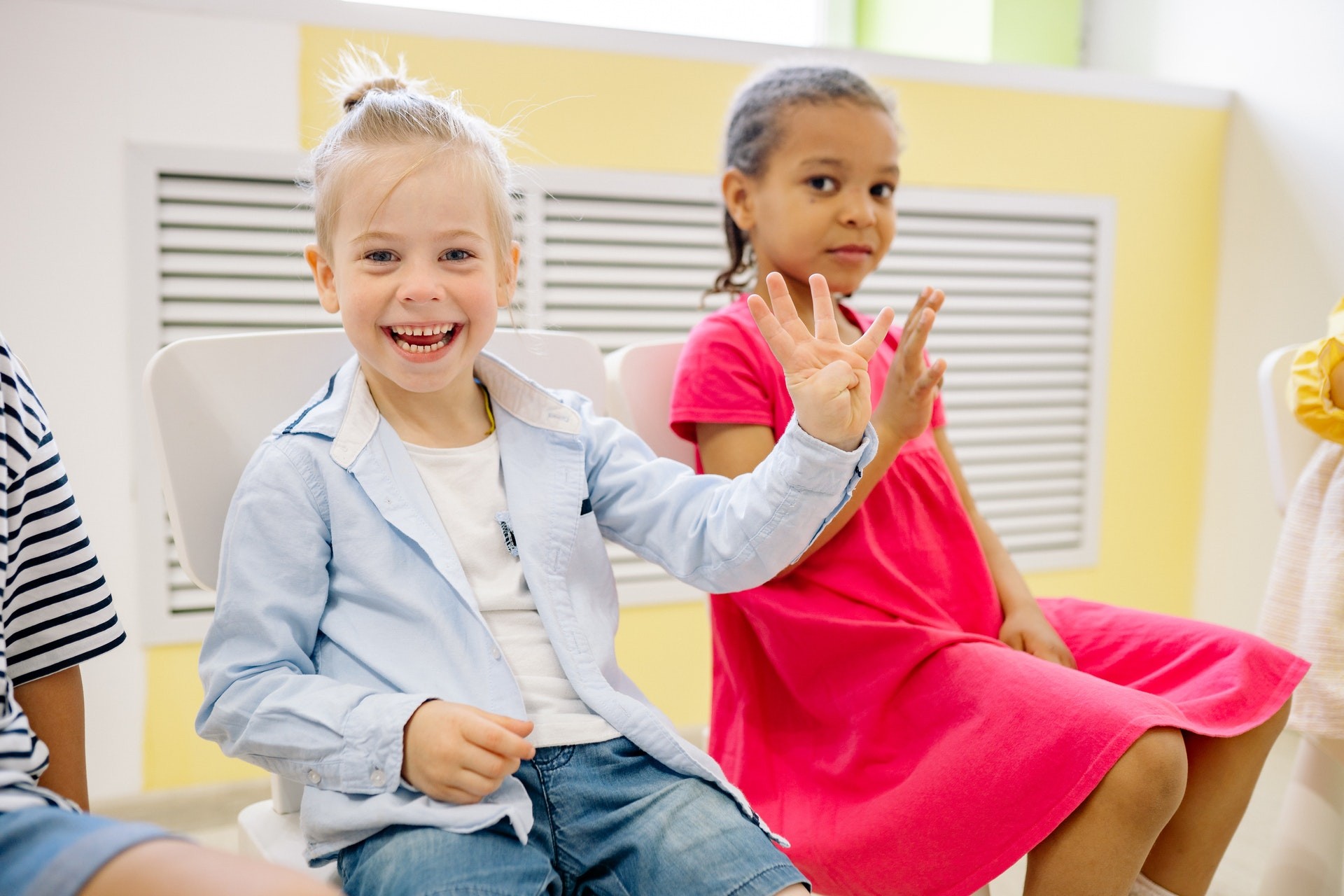 Excited students learning numbers in an elementary math classroom