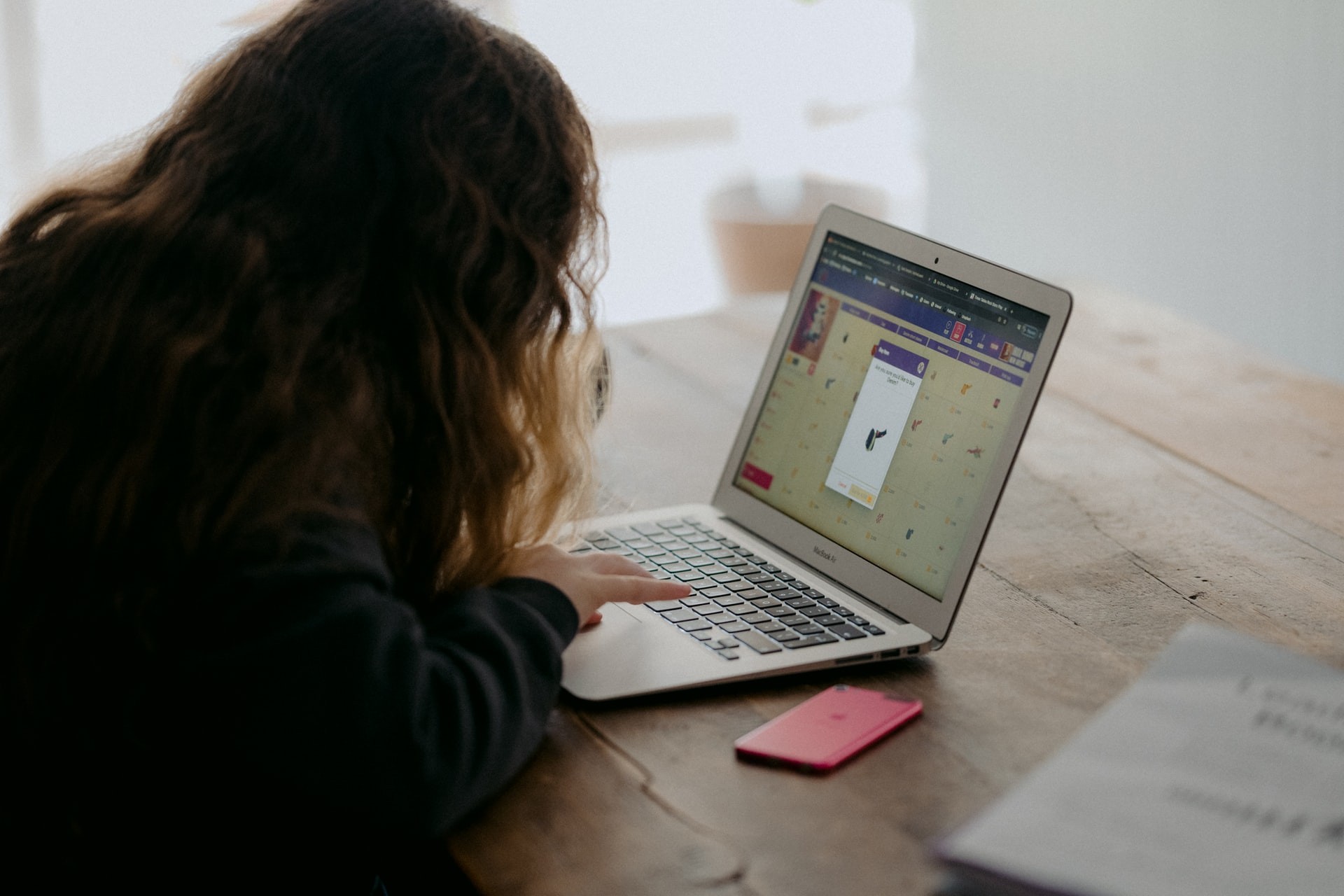 Child working through their homeschool program on the computer