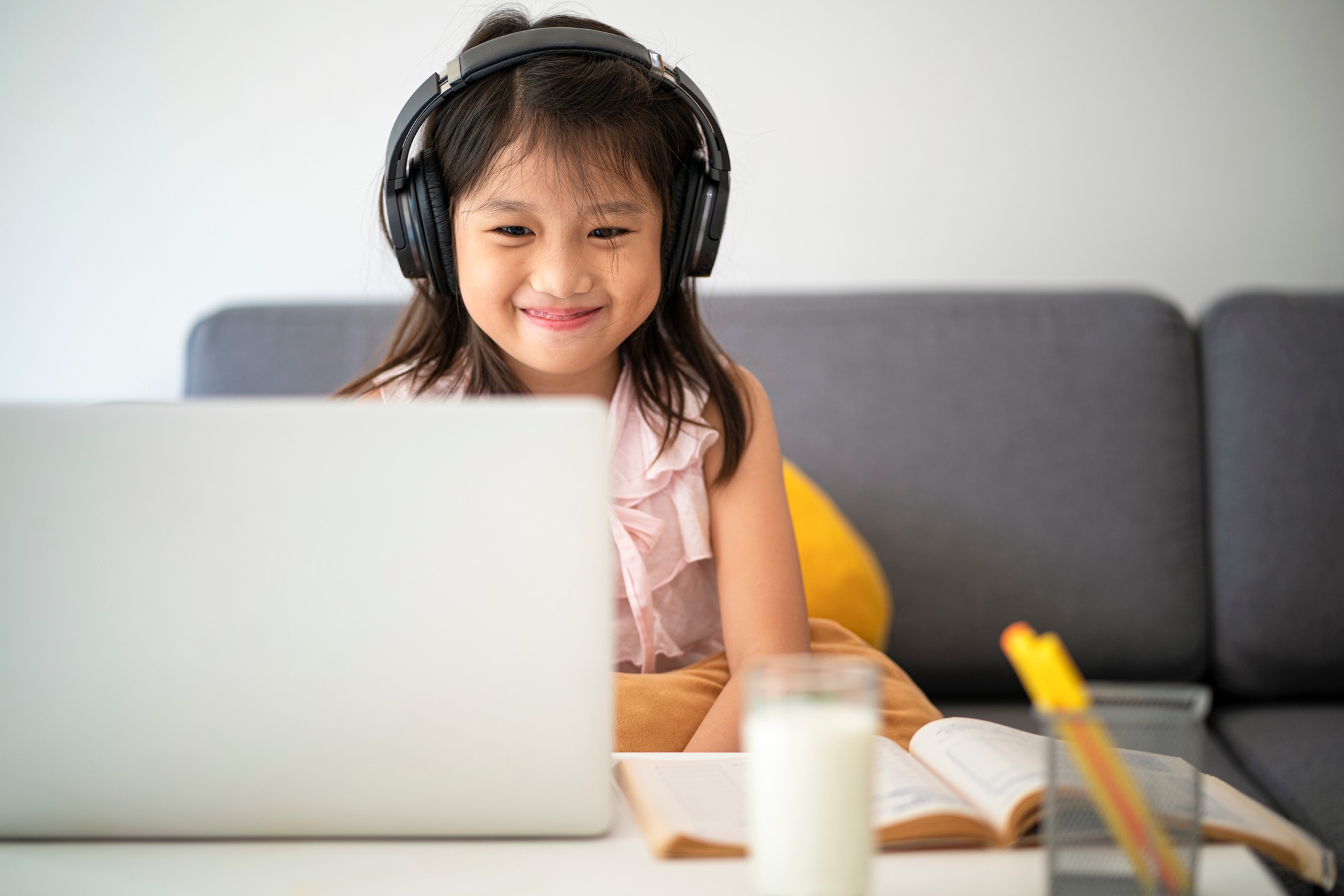 Young student smiling at her laptop