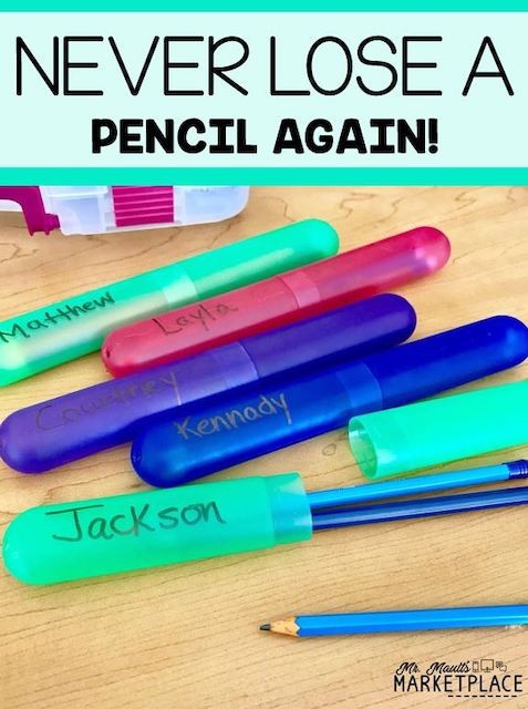 Toothbrush holders labeled with student names for holding pencils