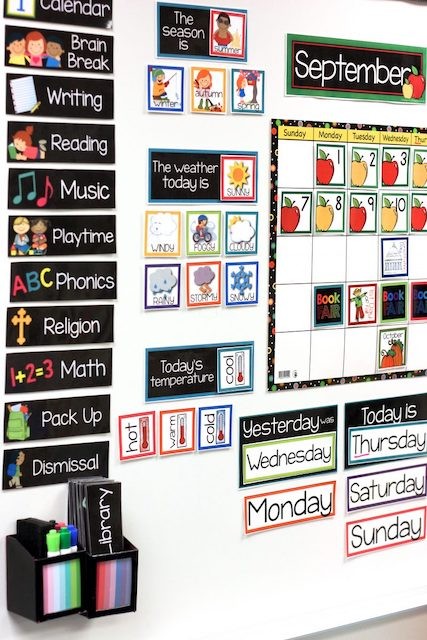 Whiteboard with labeled magnets to track schedule