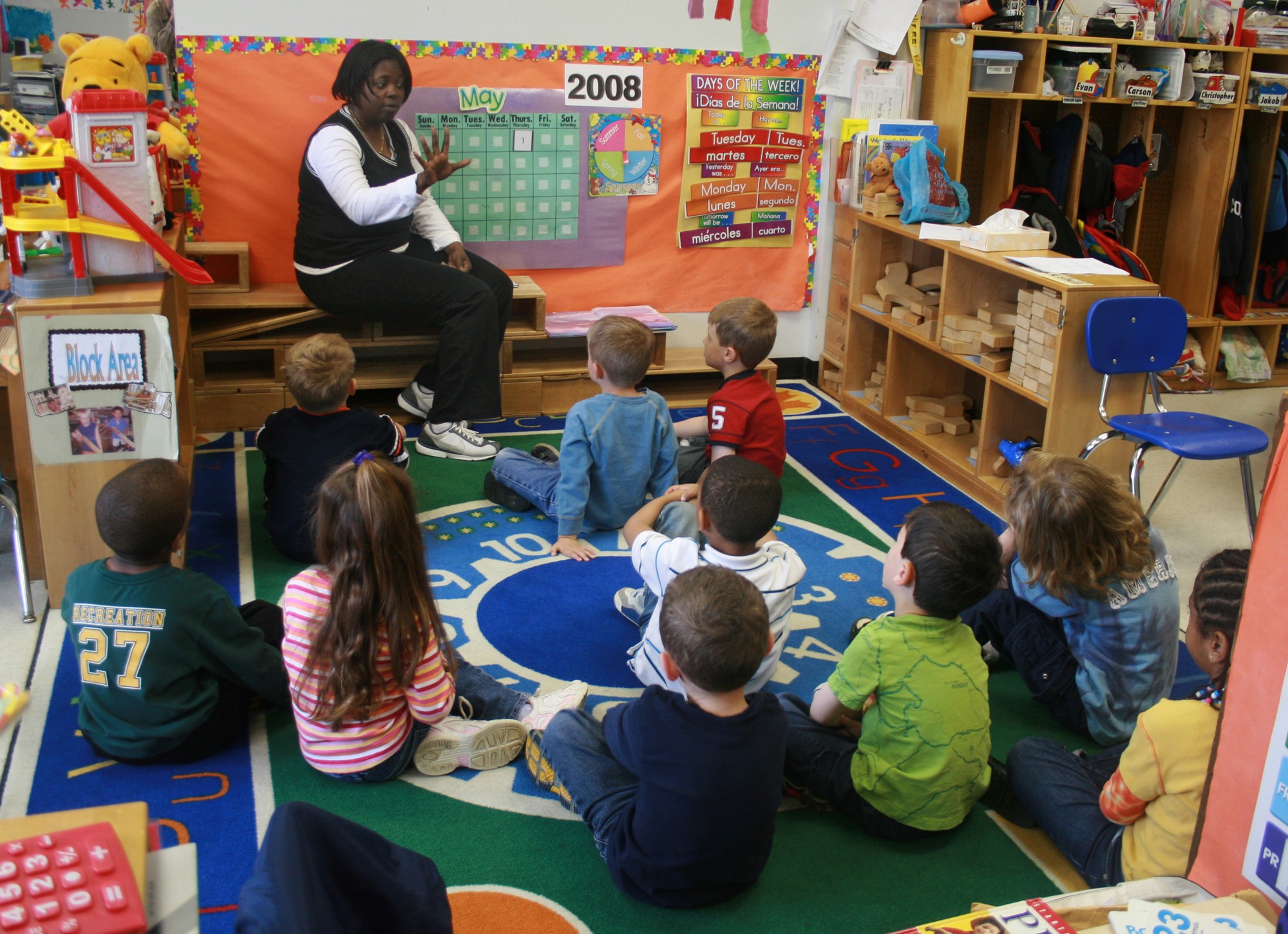 A teacher leads carpet time for her classroom community.