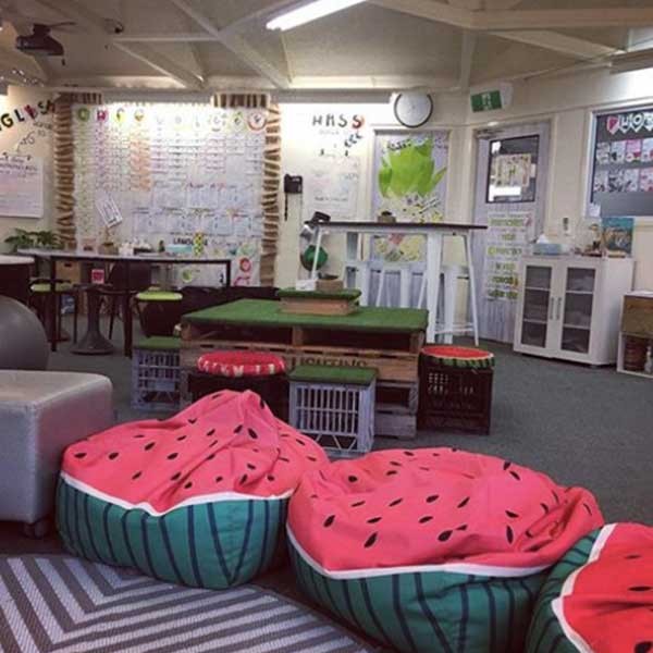 A flexible seating arrangement with bean bag chairs and crates that you can use in your classroom library.