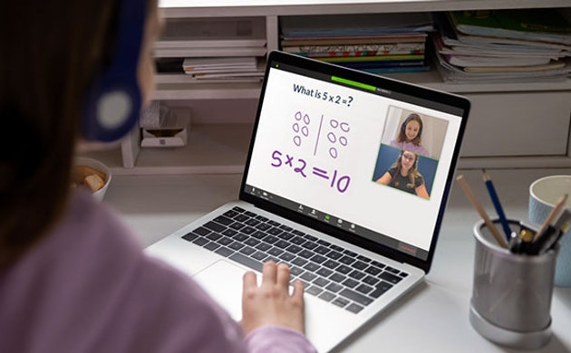A student interacts with her Prodigy online math tutor through her laptop