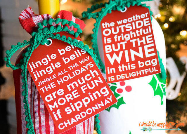 Wine bottles with holiday wrapping and gift tags.